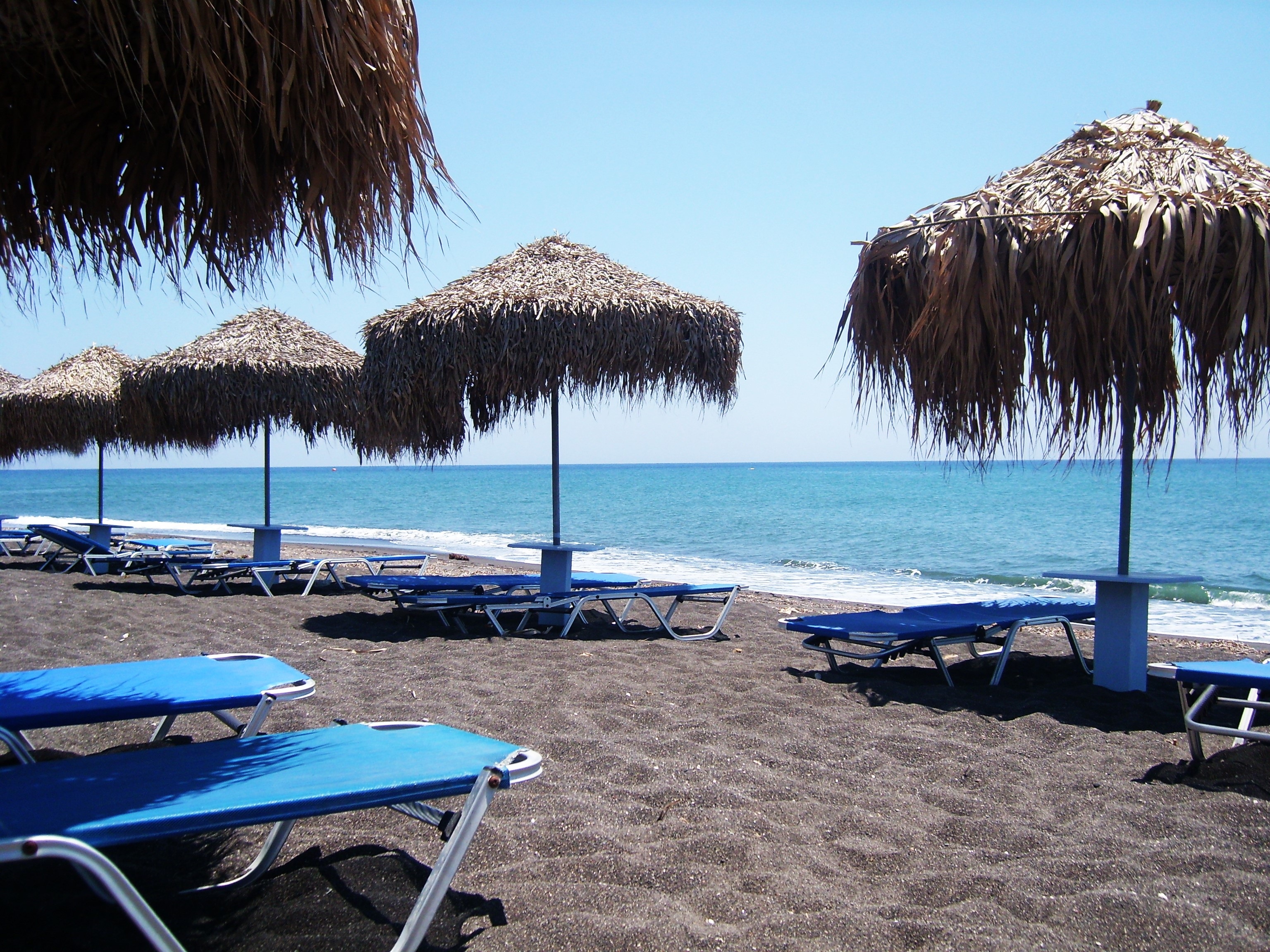 Black sand beach, boat rental in greece