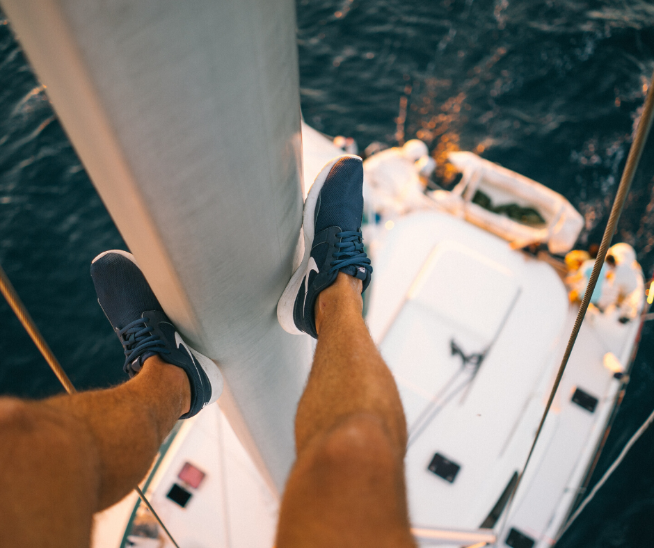 Sailing vacation in Croatia, man on the top of the boat