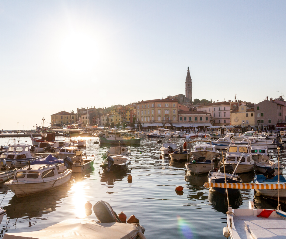 Port in Croatia, at sunset. The sea water is shining.