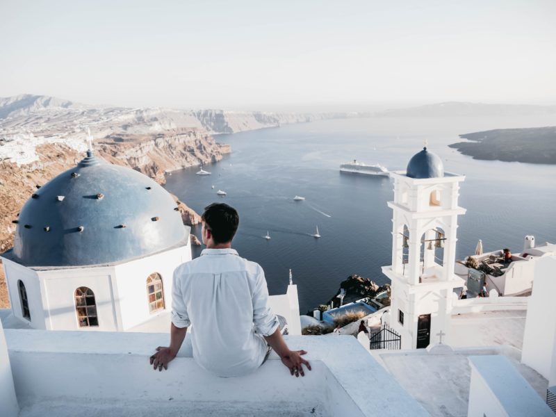 Man with relaxing views in Santorini