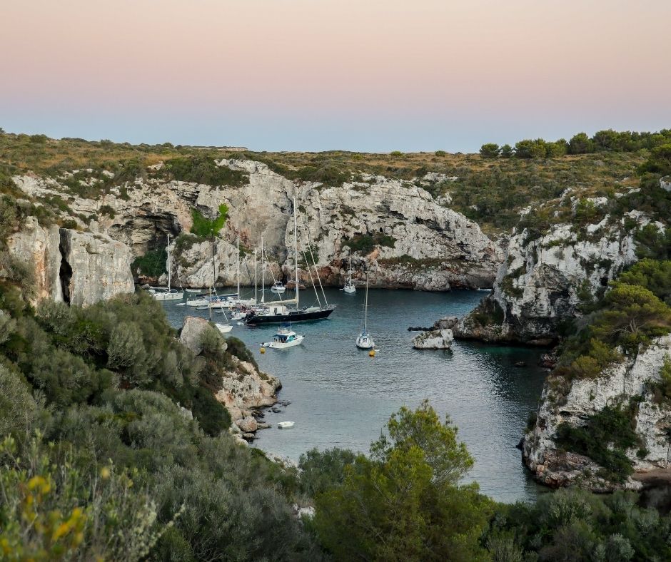 boats anchor in menorca near the caves 