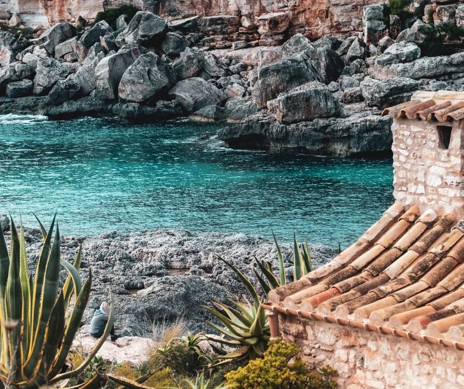 cala in menorca with the blue sea 