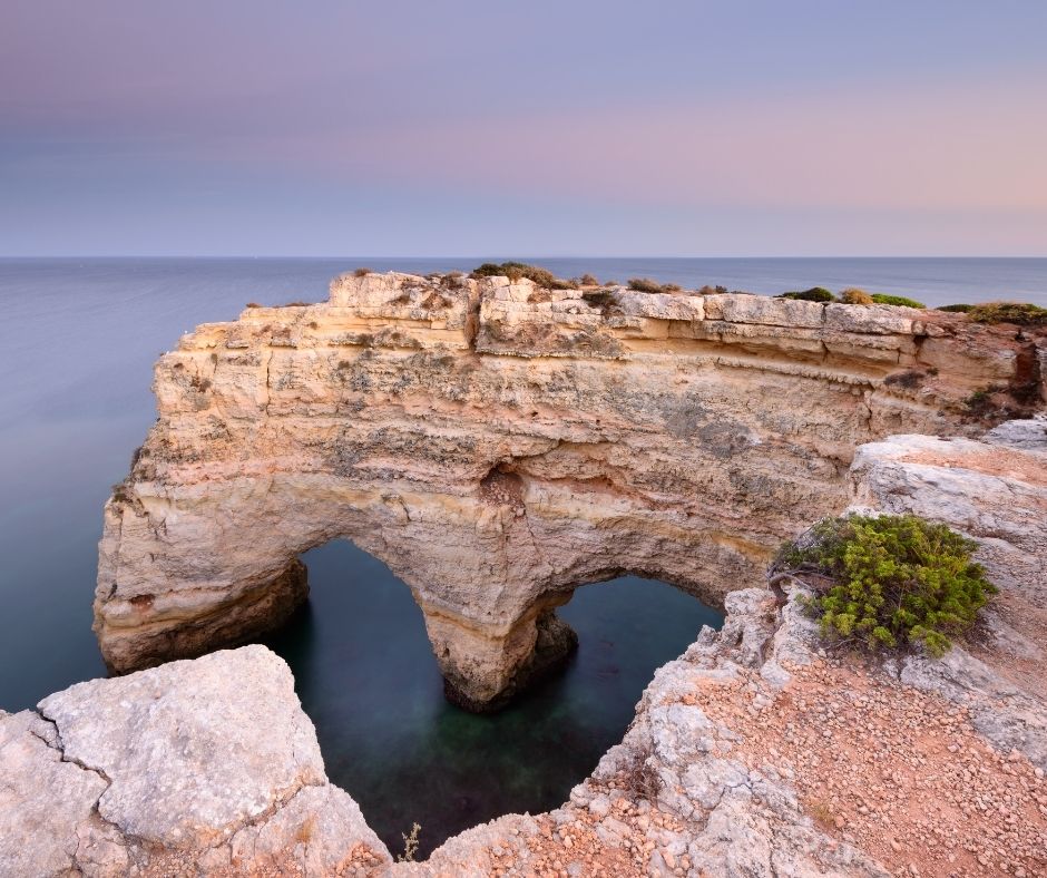 coastal view in Agrave on a sunset with a pink sky