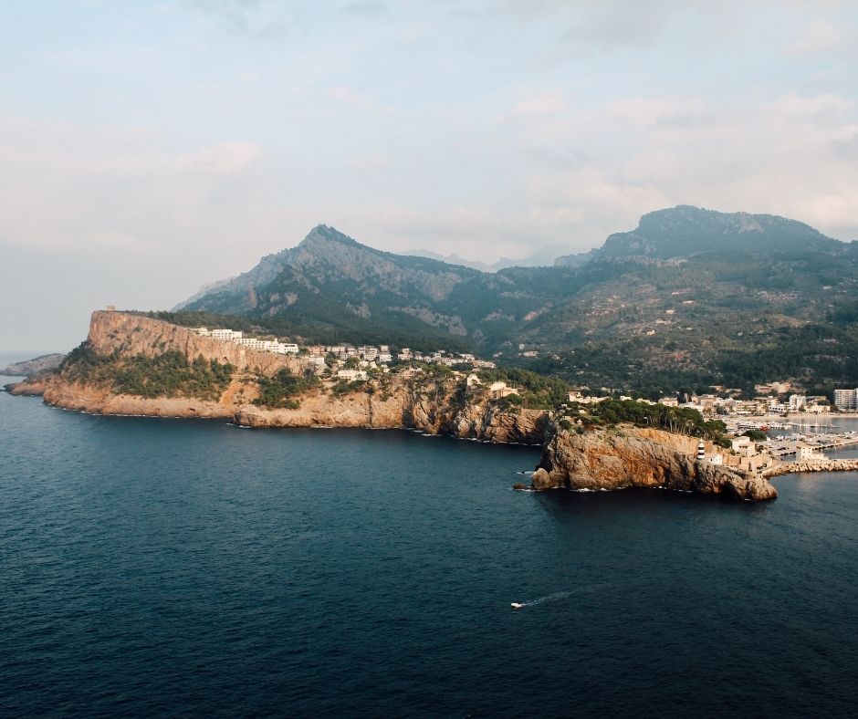 a beautiful view on Port of Sóller in Mallorca with mountains and the caves