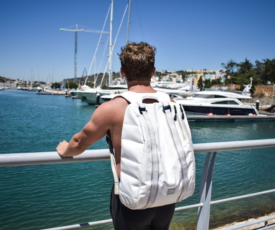 a man in a port of Albufeira sightseeing the boats