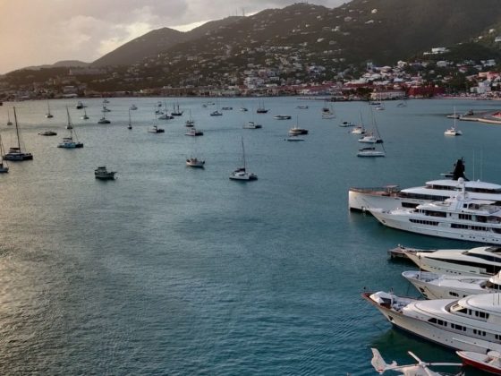 many boats and yachts sailing thorugh the US virgin islands on a sunset
