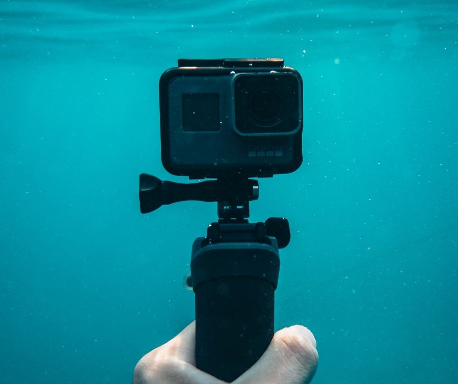 a sports camera in the water for a sailor
