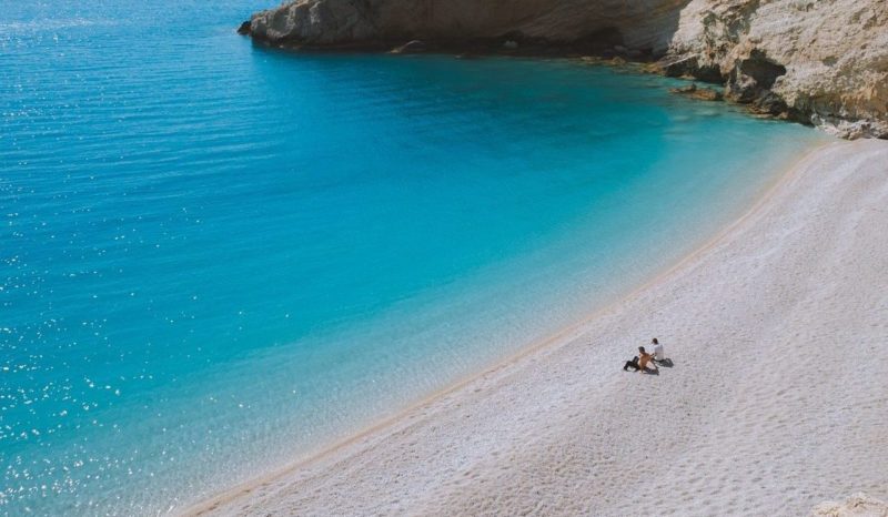 beach in Greece, sea, ocean, blue water, people relaxing,