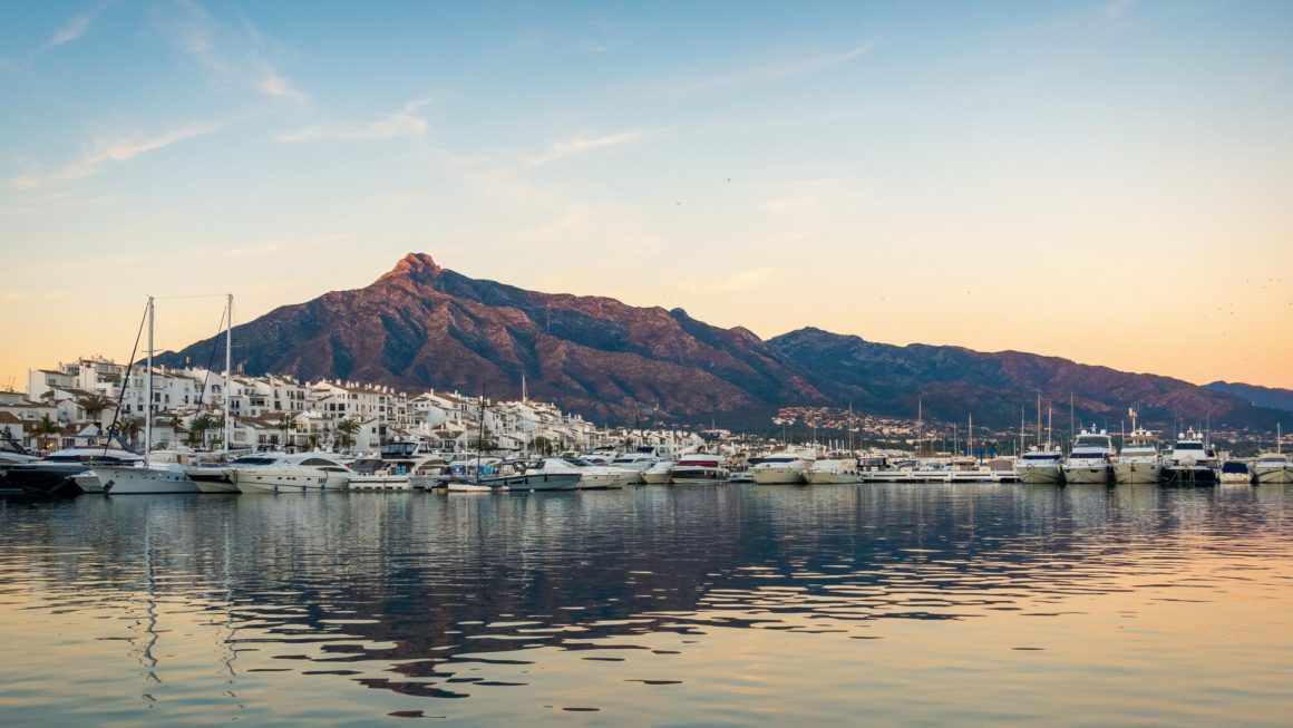 Marbella, Spain Marbella beaches, marbella mountains with boats in the front, beautiful beach view