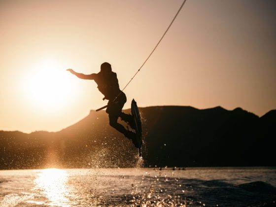 Silhouette of wakeboarder jumping in the sunset