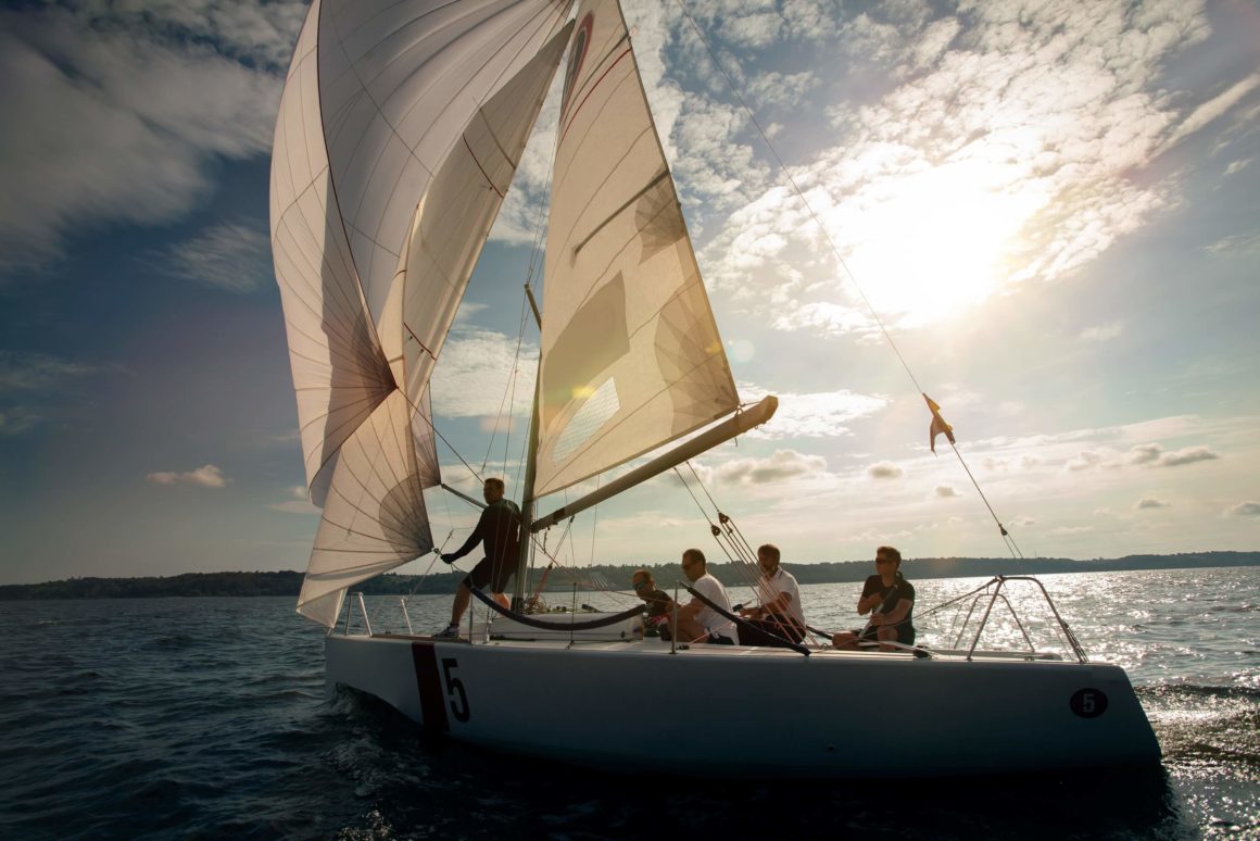 A person handling the sails of a boat