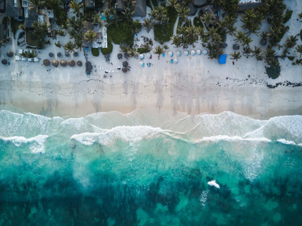 Aerial view of the ocean and beach in Tulum, Mexico