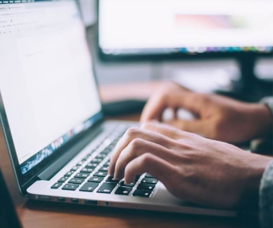 Close up image of a person typing on a laptop. Boat profitable with Nautal