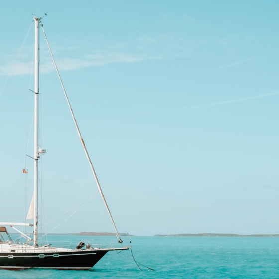 Sailboat anchored in turquoise sea